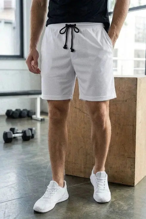 “Wearo men’s white drawstring shorts styled with a black T-shirt and white sneakers for a clean casual activewear look.”
