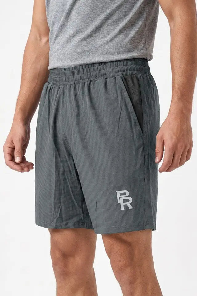 Men’s gray athletic shorts with elastic waistband and side pockets