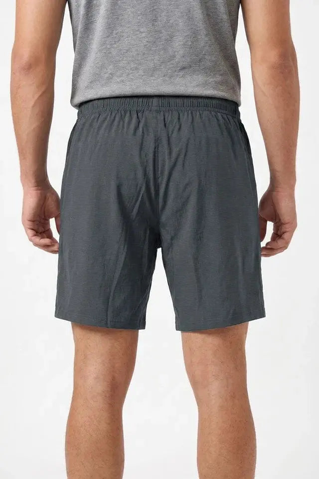 Rear view of men’s gray athletic shorts with elastic waistband